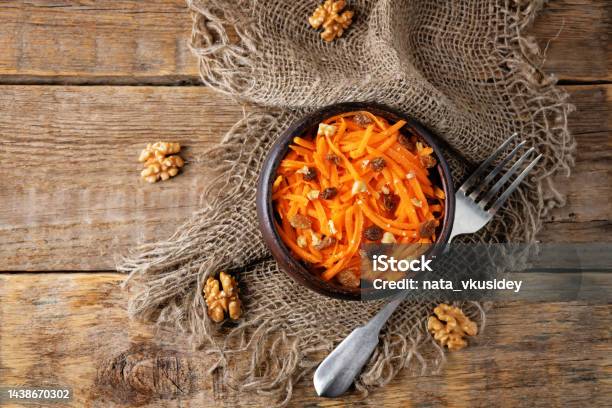 Carrot Walnut Raisin Salad With Glass Of Water Stock Photo - Download Image Now - Carrot, Salad, Raisin