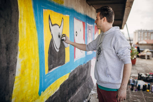 istock Male artist painting graffiti 1438672488