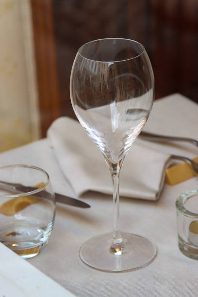 istock glass wine glass on a set table- 1438672650