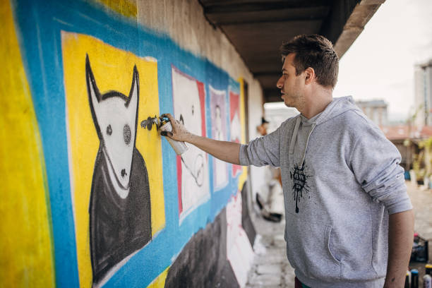 istock Male artist painting graffiti 1438672695