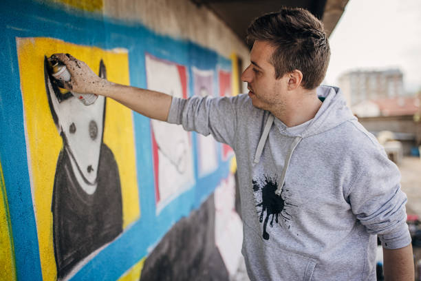 istock Male artist painting graffiti 1438672742