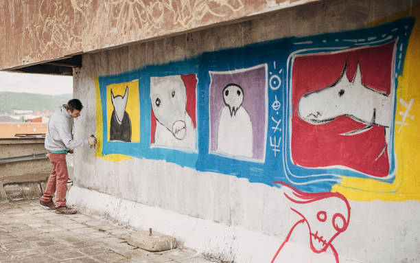istock Male artist painting graffiti 1438672949