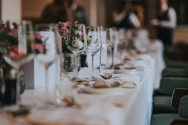 Wedding dinner table with empty glasses