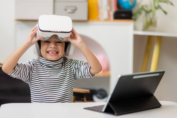 istock Asian girl study online with VR, virtual reality 1438674576
