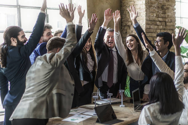 istock Successful multiracial businesspeople cheering raising hands 1438675146