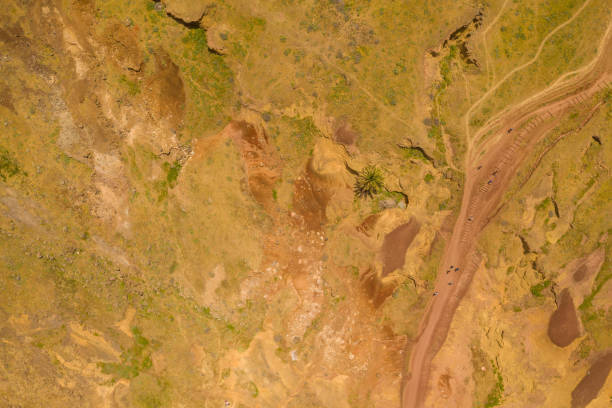 istock Drone photograph of arid landscape and a path through it 1438677612