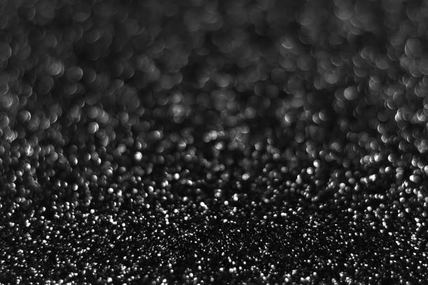 istock Gray black sparkling glitter bokeh background 1438677631