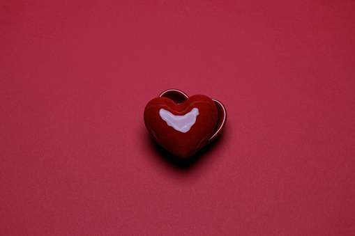 ceramic heart on the red background