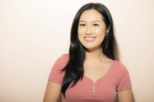 istock Happy Attractive Young Asian Chinese Woman on Neutral Backdrop 1438681207
