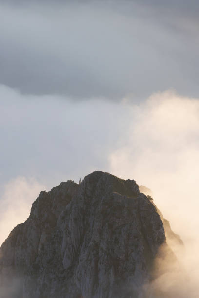 istock rocky mountain ridges at sunset with fog 1438683315
