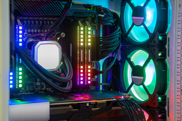 istock Close-up Hi-performance custom computer desktop for work, play game eSport and entertain on  Metaverse VR with cooling pump installed on CPU processor and multicolored LED neon light show on working 1438686213