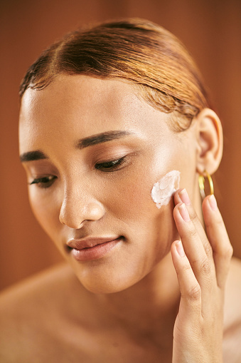Beauty, moisturizer and skincare, face and skin, natural cosmetic advertising closeup. Hispanic woman with cream, glow and fresh, cosmetology with facial care treatment and product marketing.