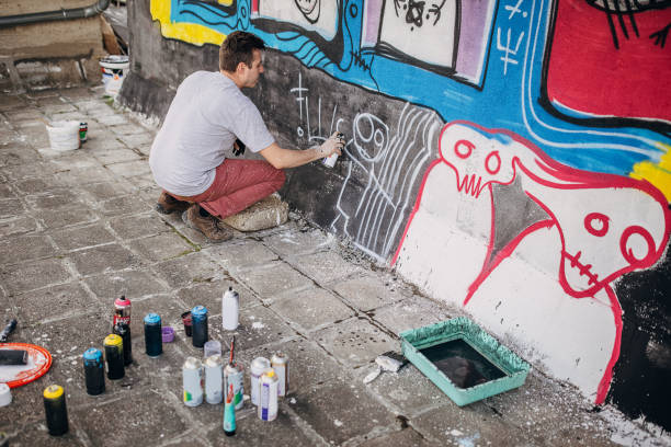 istock Male artist painting graffiti 1438686641