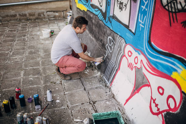 istock Male artist painting graffiti 1438686682