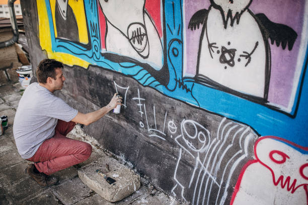 istock Male artist painting graffiti 1438686829