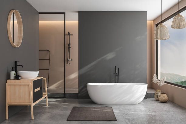 istock Modern minimalist bathroom interior, modern bathroom cabinet, white sink, wooden vanity, interior plants, bathroom accessories, bathtub and shower, black and beige walls, concrete floor. 3d rendering 1438687531