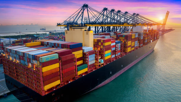 istock Aerial view of cargo ship and cargo container in harbor. 1438688030