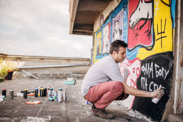 istock Artist finishing graffiti 1438688830