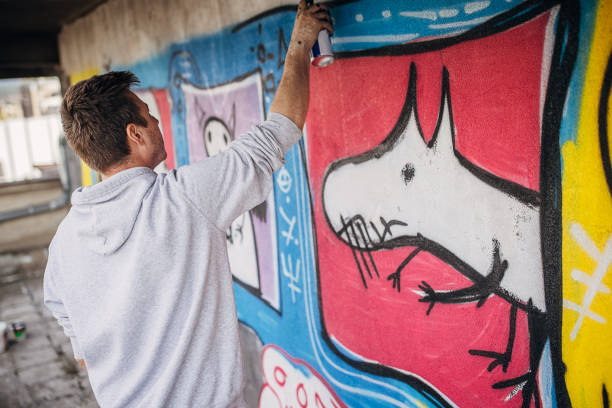 istock Male artist painting graffiti 1438689104