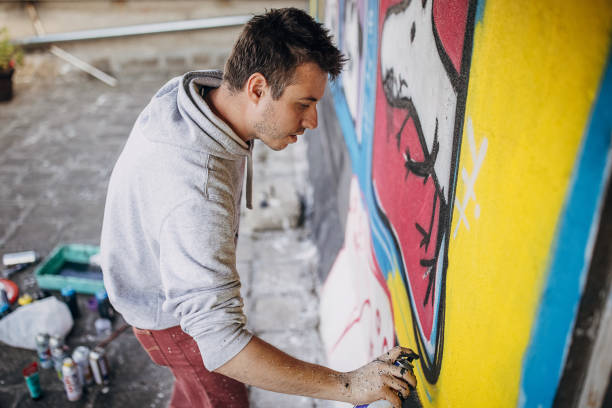 istock Male artist painting graffiti 1438689291