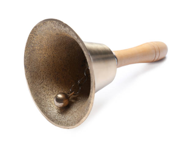istock Golden school bell with wooden handle isolated on white 1438689884