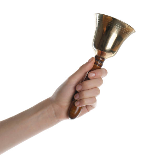 istock Woman ringing school bell on white background, closeup 1438690023