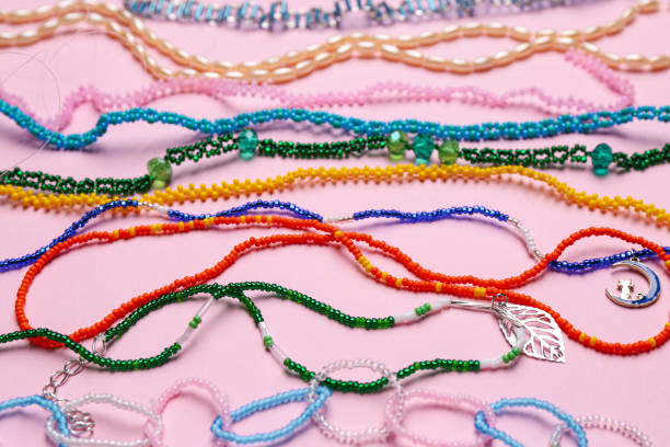istock Beautiful handmade beaded necklaces on pink background 1438690127