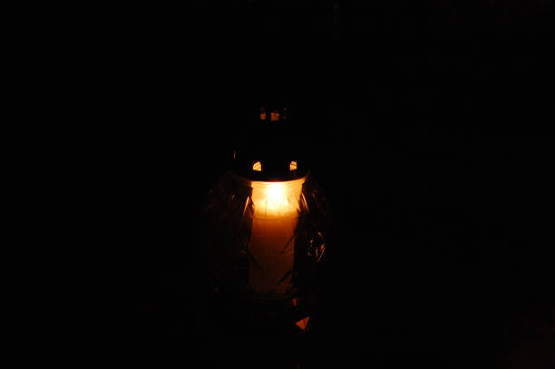 istock Votive candles burning on a cemetery. 1438690902