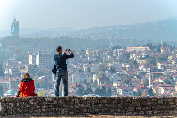 The man shooting polluted city stock photo