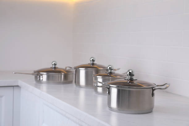 istock Set of new clean cookware on countertop in kitchen 1438694712