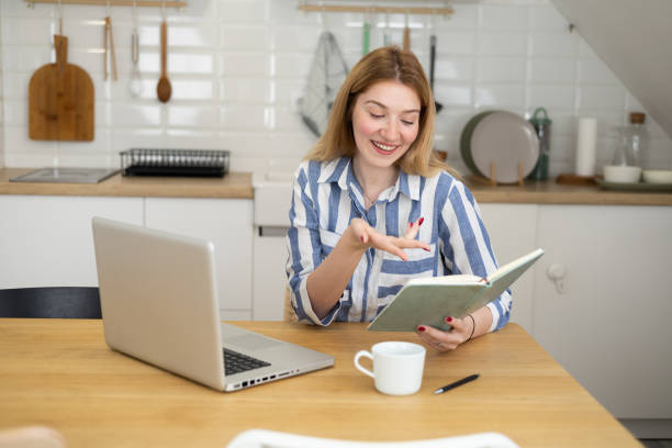 istock Young female freelancer working at her home office 1438696713