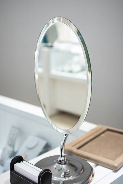 istock Vertical shot of a silver mirror on a dresser 1438696968