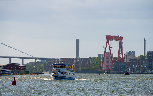 Gothenburg, Sweden - June 11 2022: Passenger ferry Älv-Snabben 3 crossing with passengers.