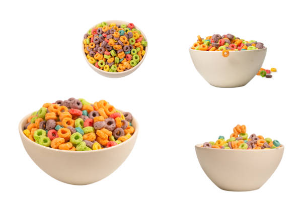 istock Colorful cereal box for morning breakfast. Corn flakes falling to the white bowl. Motion. 1438698545