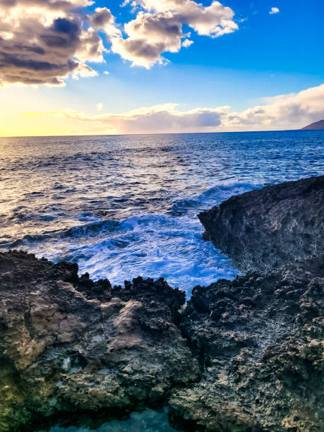 Evening in Hawaii Located in Honolulu County, Waianae is known for it's beautful waters and active marine life. Sail with the whales, dive with the dolphins, or snorkel with the turtles. sunset beach hawaii stock pictures, royalty-free photos & images
