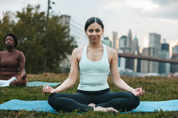 istock Women practicing yoga outdoors 1438699782