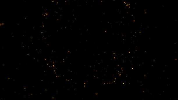 istock gold particles abstract background,Beautiful futuristic glittering in space on black background. 1438702025