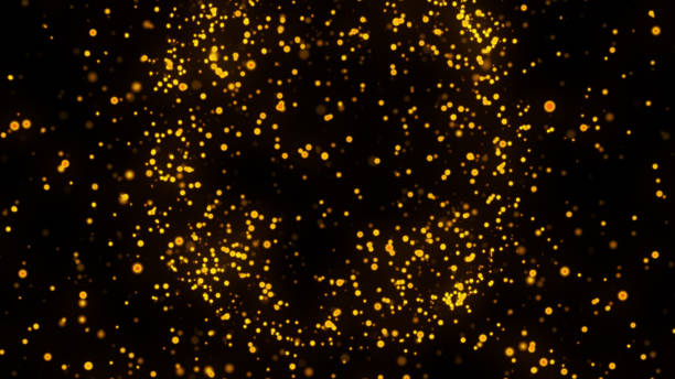 istock gold particles abstract background,Beautiful futuristic glittering in space on black background. 1438702028