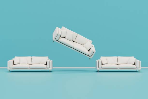 istock upholstered furniture for relaxation. soft white sofas flying on a blue background. 3D render 1438702033