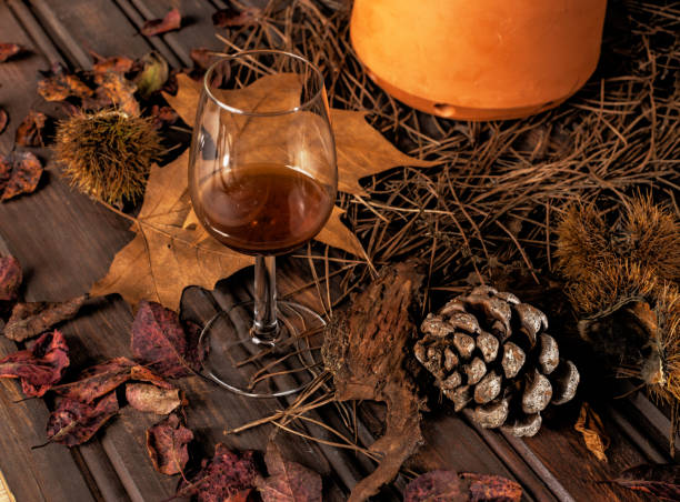 istock Autumn table with chestnuts, leaves and jeropiga. 1438702047