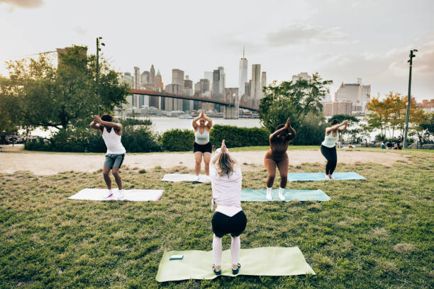 istock People practicing yoga outdoors 1438706061