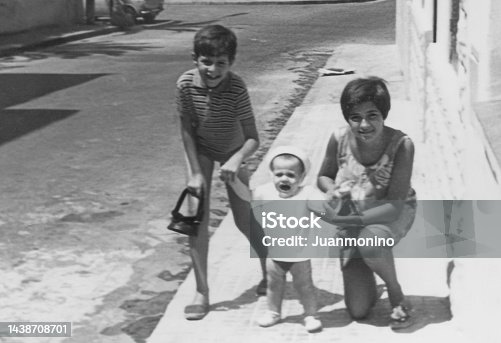 istock Black and white Image taken in the 60s: children Siblings posing together 1438708701