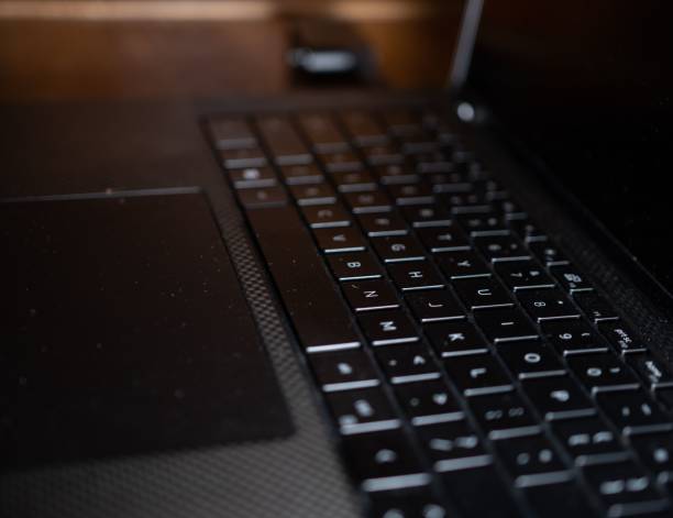 istock Selective focus on a black laptop keyboard, and a turned-off screen - a concept of a communication 1438710007