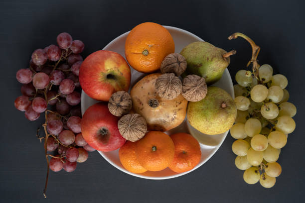istock Paris, France - 10 30 2022: still life. Studio shot of mixed fruit in natural sun light 1438710097