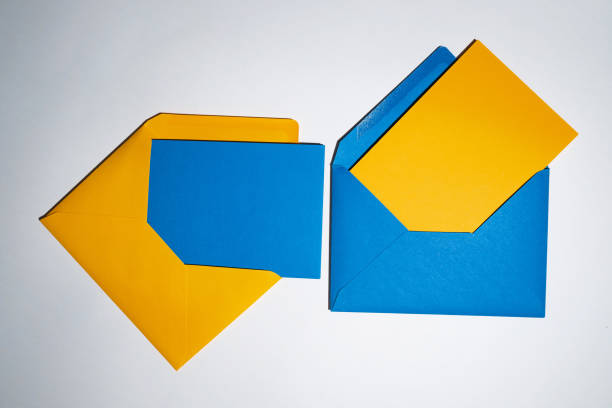 istock Yellow and blue envelopes on a white background. A set of envelopes in different types. Paper envelopes for inscriptions. Top view mockup 1438714559