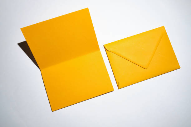 istock Yellow envelopes on a white background. A set of envelopes in different types. Paper envelopes for inscriptions. Top view mockup 1438714565