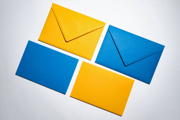 Yellow and blue envelopes on a white background. A set of envelopes in different types. Paper envelopes for inscriptions. Top view mockup