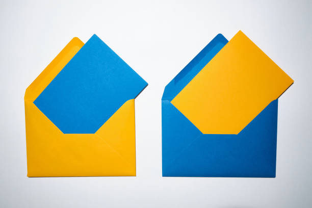 istock Yellow and blue envelopes on a white background. A set of envelopes in different types. Paper envelopes for inscriptions. Top view mockup 1438714581
