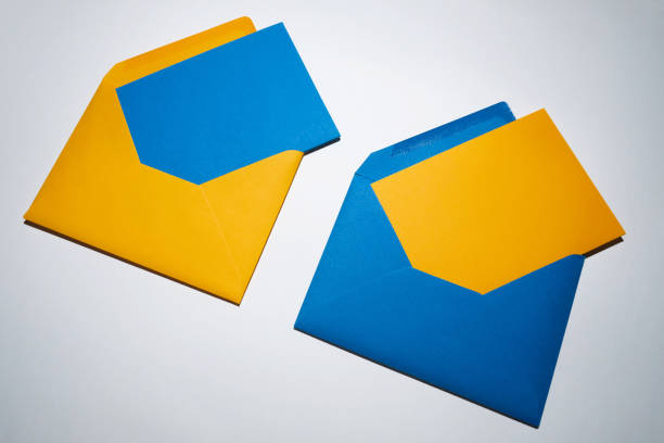 istock Yellow and blue envelopes on a white background. A set of envelopes in different types. Paper envelopes for inscriptions. Top view mockup 1438714587