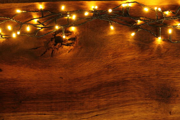 istock wooden board with fairy lights 1438714633